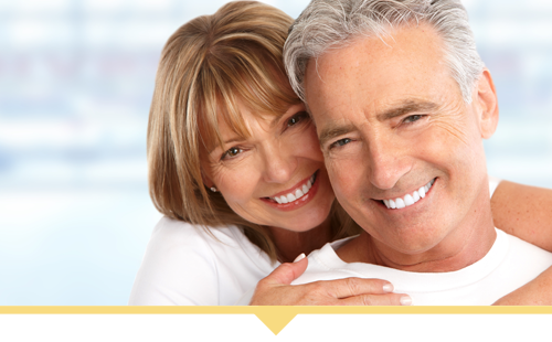 Couple Smiling With Dental Crowns